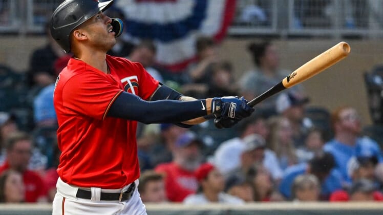 May 27, 2022; Minneapolis, Minnesota, USA; Minnesota Twins shortstop Carlos Correa (4) hits a solo home run against the Kansas City Royals during the fourth inning at Target Field. Mandatory Credit: Nick Wosika-USA TODAY Sports