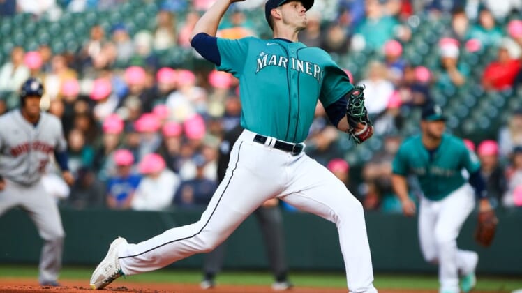 May 27, 2022; Seattle, Washington, USA;  Seattle Mariners starting pitcher Chris Flexen (77) delivers against the Houston Astros during the first inning at T-Mobile Park. Mandatory Credit: Lindsey Wasson-USA TODAY Sports