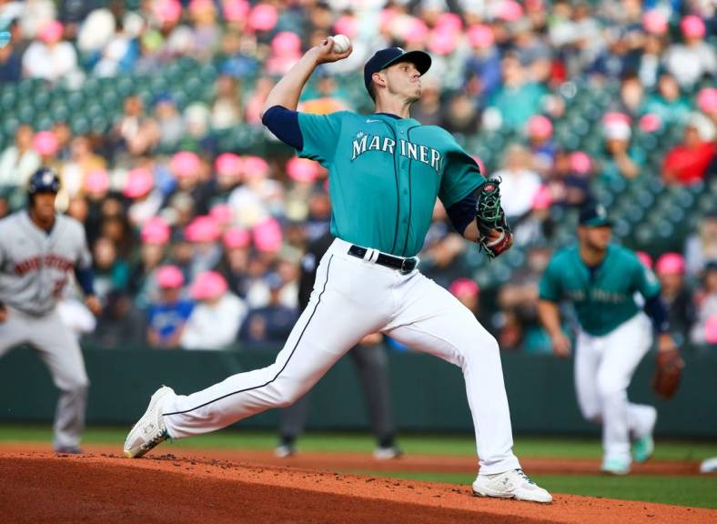 May 27, 2022; Seattle, Washington, USA;  Seattle Mariners starting pitcher Chris Flexen (77) delivers against the Houston Astros during the first inning at T-Mobile Park. Mandatory Credit: Lindsey Wasson-USA TODAY Sports