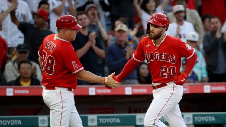 May 27, 2022; Anaheim, California, USA; Los Angeles Angels first baseman Jared Walsh (20) is congratulated by third base coach Phil Nevin (88) after hitting a home run in the third inning against Toronto Blue Jays at Angel Stadium. Mandatory Credit: Kiyoshi Mio-USA TODAY Sports