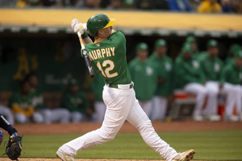 May 27, 2022; Oakland, California, USA; Oakland Athletics catcher Sean Murphy (12) follows the flight of his solo home run off Texas Rangers starting pitcher Jon Gray during the third inning at RingCentral Coliseum. Mandatory Credit: D. Ross Cameron-USA TODAY Sports