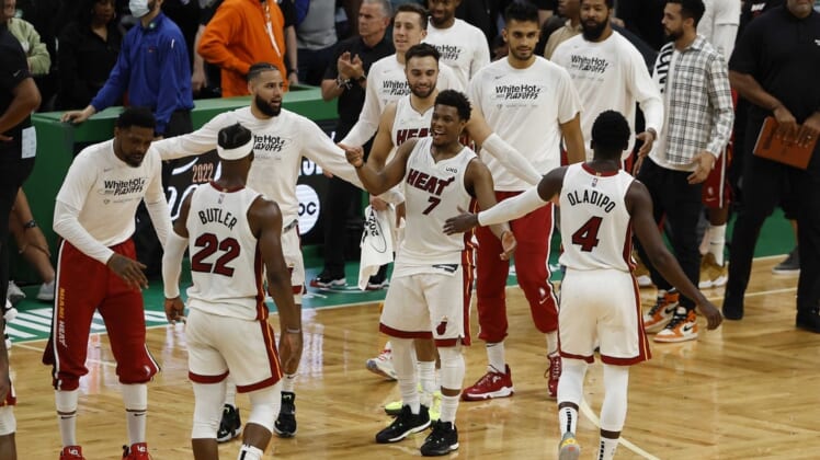 May 27, 2022; Boston, Massachusetts, USA; Miami Heat guard Kyle Lowry (7) greets guard Victor Oladipo (4) and forward Jimmy Butler (22) during the second half in game six of the 2022 eastern conference finals at TD Garden. Mandatory Credit: Winslow Townson-USA TODAY Sports