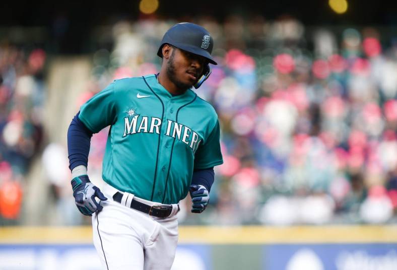 May 27, 2022; Seattle, Washington, USA;  Seattle Mariners designated hitter Kyle Lewis (1) rounds third base after hitting a two-run home run against the Houston Astros during the first inning at T-Mobile Park. Mandatory Credit: Lindsey Wasson-USA TODAY Sports