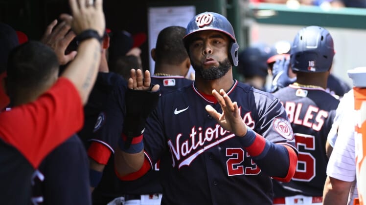 May 28, 2022; Washington, District of Columbia, USA; Washington Nationals designated hitter Nelson Cruz (23) is congratulated by teammates after scoring a run against the Colorado Rockies during the second inning at Nationals Park. Mandatory Credit: Brad Mills-USA TODAY Sports