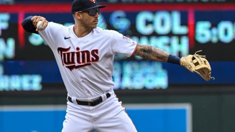 May 28, 2022; Minneapolis, Minnesota, USA;  Minnesota Twins shortstop Carlos Correa (4) throws to first base for a force out against the Kansas City Royals during the first inning at Target Field. Mandatory Credit: Nick Wosika-USA TODAY Sports