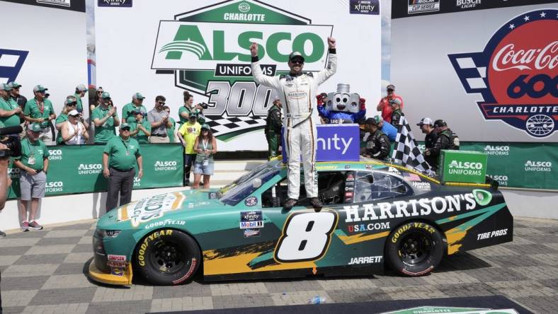 May 28, 2022; Concord, North Carolina, USA;  NASCAR Xfinity Series driver Josh Berry (8) celebrates his win during the Alsco Uniforms 300 at Charlotte Motor Speedway. Mandatory Credit: Jim Dedmon-USA TODAY Sports