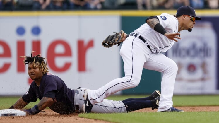 May 28, 2022; Detroit, Michigan, USA;  Cleveland Guardians third baseman Jose Ramirez (11) steals second base ahead of the throw to Detroit Tigers shortstop Javier Baez (28) in the fourth inning at Comerica Park. Mandatory Credit: Rick Osentoski-USA TODAY Sports
