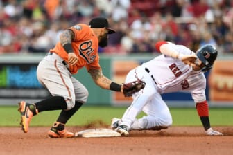 May 28, 2022; Boston, Massachusetts, USA; Boston Red Sox second baseman Trevor Story (10) slides safely into second beating a tag from Baltimore Orioles second baseman Rougned Odor (12) during the fourth inning at Fenway Park. Mandatory Credit: Brian Fluharty-USA TODAY Sports