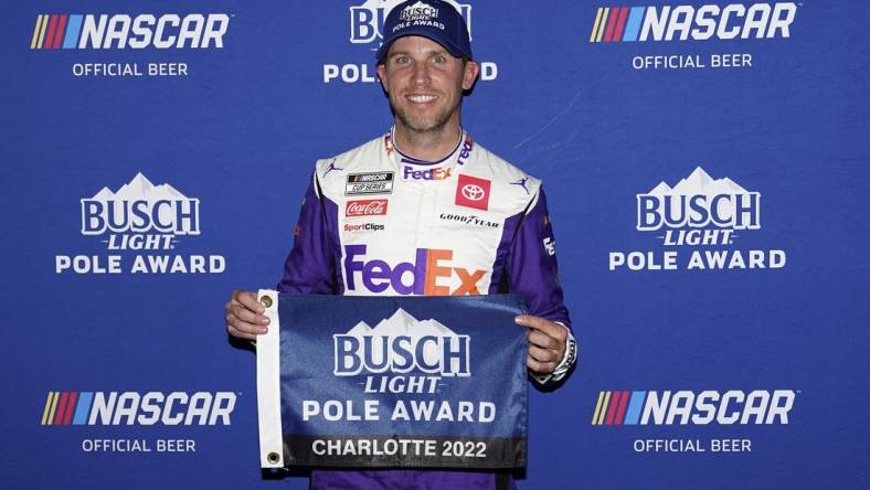 May 28, 2022; Concord, North Carolina, USA; NASCAR Cup Series driver Denny Hamlin poses for a picture after winning the pole for the Coca-Cola 600 at Charlotte Motor Speedway. Mandatory Credit: Jasen Vinlove-USA TODAY Sports