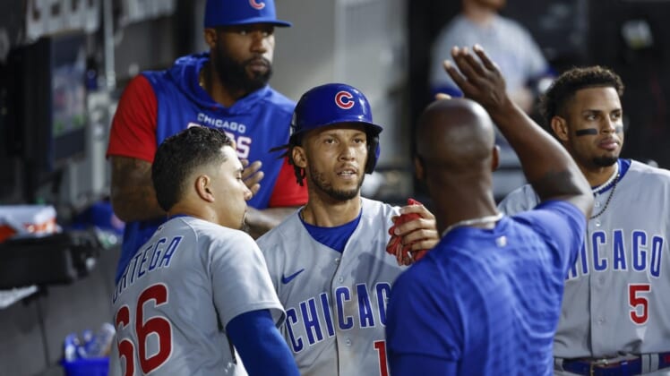 May 28, 2022; Chicago, Illinois, USA; Chicago Cubs shortstop Andrelton Simmons (19) celebrates with teammates after scoring against the Chicago White Sox during the seventh inning at Guaranteed Rate Field. Mandatory Credit: Kamil Krzaczynski-USA TODAY Sports