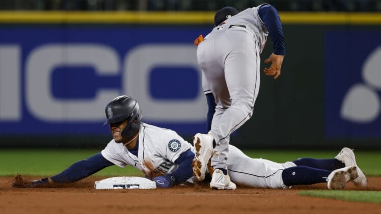 May 28, 2022; Seattle, Washington, USA; Seattle Mariners center fielder Julio Rodriguez (44) steals second base against the Houston Astros during the first inning at T-Mobile Park. Mandatory Credit: Joe Nicholson-USA TODAY Sports