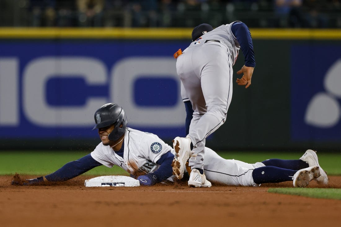 May 28, 2022; Seattle, Washington, USA; Seattle Mariners center fielder Julio Rodriguez (44) steals second base against the Houston Astros during the first inning at T-Mobile Park. Mandatory Credit: Joe Nicholson-USA TODAY Sports