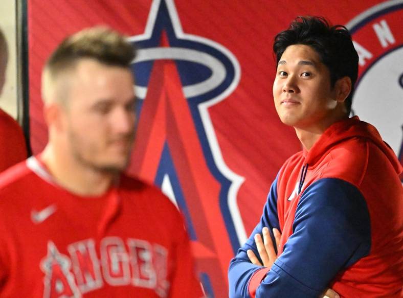 May 28, 2022; Anaheim, California, USA;  Los Angeles Angels center fielder Mike Trout (27) talks with Los Angeles Angels designated hitter Shohei Ohtani (17) in the dugout during the game against the Toronto Blue Jays at Angel Stadium. Mandatory Credit: Jayne Kamin-Oncea-USA TODAY Sports