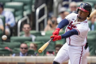 May 29, 2022; Cumberland, Georgia, USA; Atlanta Braves second baseman Ozzie Albies (1) hits a double before scoring against the Miami Marlins during the second inning at Truist Park. Mandatory Credit: Dale Zanine-USA TODAY Sports