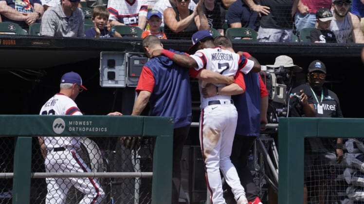 May 29, 2022; Chicago, Illinois, USA; Chicago White Sox shortstop Tim Anderson (7) is helped off the field after getting injured against the Chicago Cubs during the fifth inning at Guaranteed Rate Field. Mandatory Credit: David Banks-USA TODAY Sports