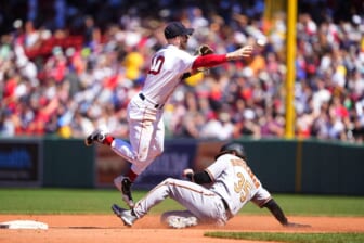 May 29, 2022; Boston, Massachusetts, USA; Boston Red Sox second baseman Trevor Story (10) turns a double play with Baltimore Orioles designated hitter Adley Rutschman (35) sliding into second base during the fourth inning at Fenway Park. Mandatory Credit: Gregory Fisher-USA TODAY Sports