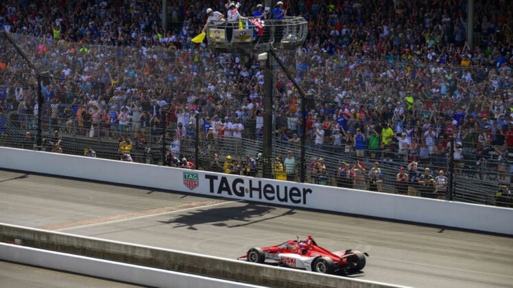 May 29, 2022; Indianapolis, Indiana, USA; Chip Ganassi Racing driver Marcus Ericsson (8) of Sweden crosses the finish line and wins the106th running of the Indianapolis 500 at Indianapolis Motor Speedway. Mandatory Credit: Jerome Miron-USA TODAY Sports
