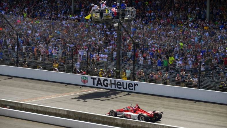 May 29, 2022; Indianapolis, Indiana, USA; Chip Ganassi Racing driver Marcus Ericsson (8) of Sweden crosses the finish line and wins the106th running of the Indianapolis 500 at Indianapolis Motor Speedway. Mandatory Credit: Jerome Miron-USA TODAY Sports