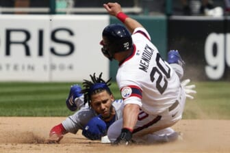 May 29, 2022; Chicago, Illinois, USA; Chicago Cubs second baseman Andrelton Simmons (19) forces out Chicago White Sox shortstop Danny Mendick (20) at second base during the sixth inning at Guaranteed Rate Field. Mandatory Credit: David Banks-USA TODAY Sports