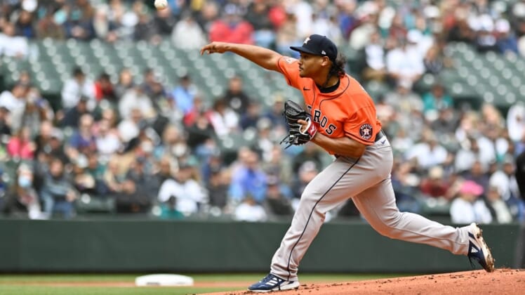 May 29, 2022; Seattle, Washington, USA; Houston Astros starting pitcher Luis Garcia (77) pitches to the Seattle Mariners during the first inning at T-Mobile Park. Mandatory Credit: Steven Bisig-USA TODAY Sports