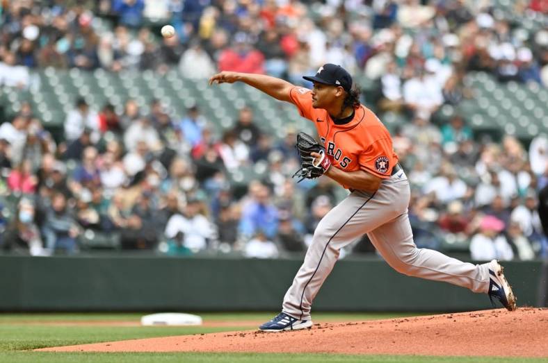 May 29, 2022; Seattle, Washington, USA; Houston Astros starting pitcher Luis Garcia (77) pitches to the Seattle Mariners during the first inning at T-Mobile Park. Mandatory Credit: Steven Bisig-USA TODAY Sports