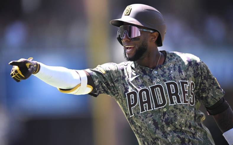 May 29, 2022; San Diego, California, USA; San Diego Padres left fielder Jurickson Profar (10) gestures toward the Padres dugout while rounding the bases after hitting a two-run home run against the Pittsburgh Pirates during the fifth inning at Petco Park. Mandatory Credit: Orlando Ramirez-USA TODAY Sports