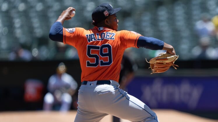 May 30, 2022; Oakland, California, USA; Houston Astros starting pitcher Framber Valdez (59) pitches during the first inning against the Oakland Athletics at RingCentral Coliseum. Mandatory Credit: Stan Szeto-USA TODAY Sports