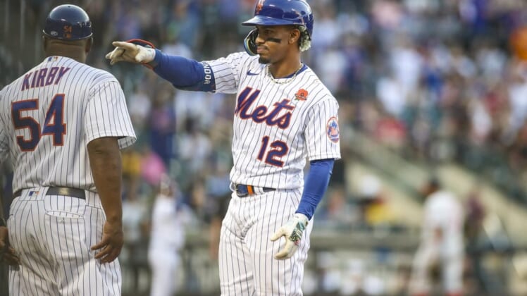May 30, 2022; New York City, New York, USA; New York Mets shortstop Francisco Lindor (12) points to the dugout after hitting an RBI single in the first inning against the Washington Nationals at Citi Field. Mandatory Credit: Wendell Cruz-USA TODAY Sports