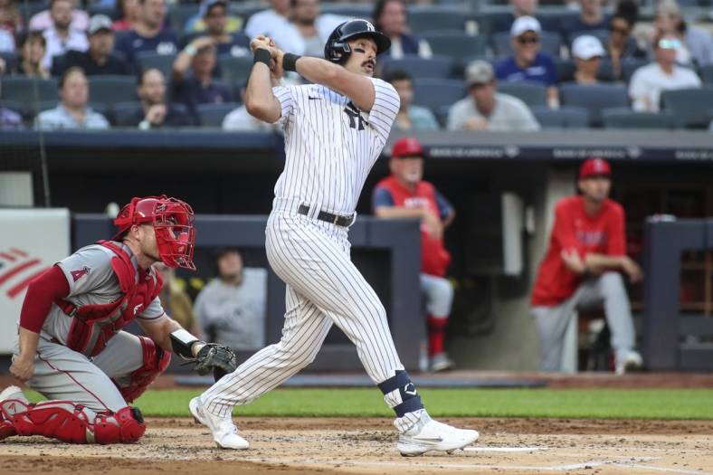 May 31, 2022; Bronx, New York, USA;  New York Yankees designated hitter Matt Carpenter (24) hits a two-run home run in the first inning against the Los Angeles Angels at Yankee Stadium. Mandatory Credit: Wendell Cruz-USA TODAY Sports