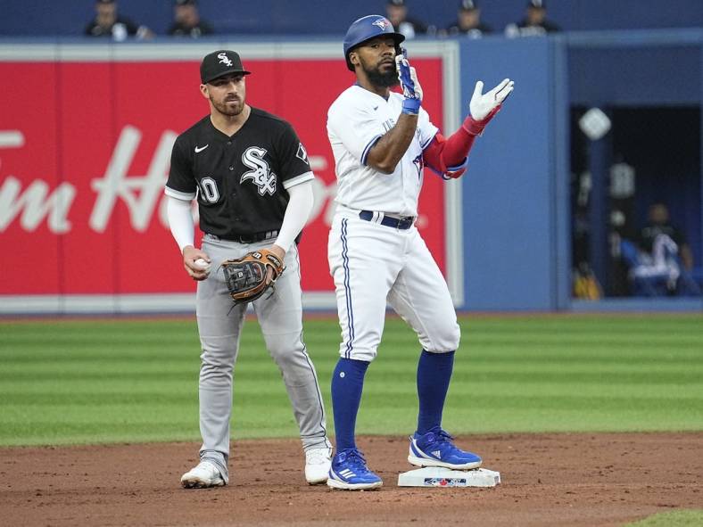 May 31, 2022; Toronto, Ontario, CAN; Toronto Blue Jays right fielder Teoscar Hernandez (37) reacts after hitting a double as Chicago White Sox shortstop Danny Mendick (20) looks on during the second inning at Rogers Centre. Mandatory Credit: John E. Sokolowski-USA TODAY Sports