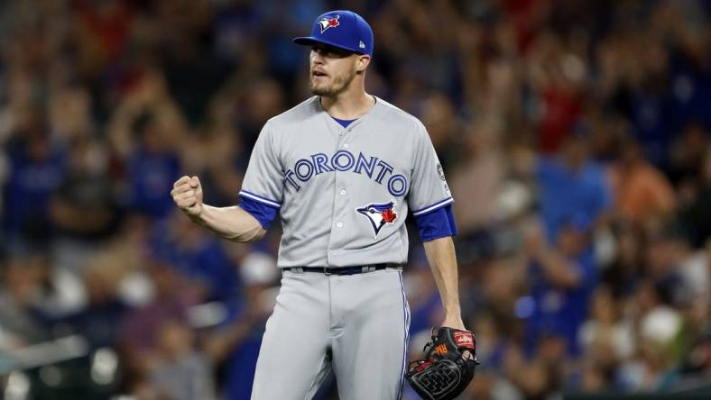 Aug 4, 2018; Seattle, WA, USA; Toronto Blue Jays relief pitcher Ken Giles (51) pumps his fist after his infield turned a double play to end the game against the Seattle Mariners during the ninth inning at Safeco Field. Mandatory Credit: Jennifer Buchanan-USA TODAY Sports