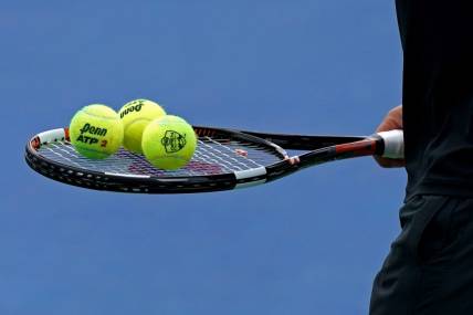 Aug 11, 2018; Mason, OH, USA; A view of the Penn tennis balls on the racket of Marcos Baghdatis (CYP) as he prepares to serve against Feliciano Lopez (ESP) in the Western and Southern tennis open at Lindner Family Tennis Center. Mandatory Credit: Aaron Doster-USA TODAY Sports