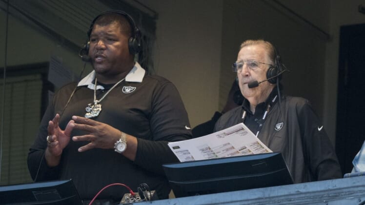 August 24, 2018; Oakland, CA, USA; Oakland Raiders broadcasters Lincoln Kennedy (left) and Brent Musburger (right) before the game against the Green Bay Packers at Oakland Coliseum. Mandatory Credit: Kyle Terada-USA TODAY Sports
