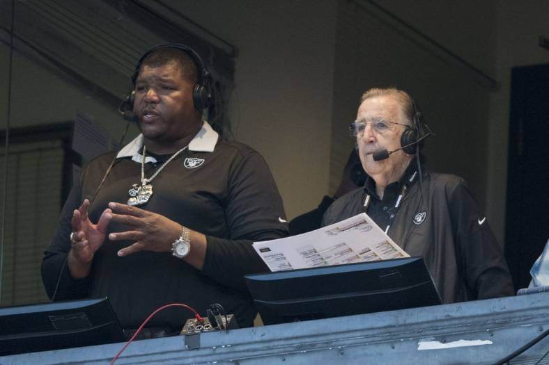 August 24, 2018; Oakland, CA, USA; Oakland Raiders broadcasters Lincoln Kennedy (left) and Brent Musburger (right) before the game against the Green Bay Packers at Oakland Coliseum. Mandatory Credit: Kyle Terada-USA TODAY Sports