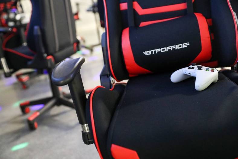 A gaming chair and controller are seen during an Evolve Youth Sports practice at the Player One arena in Carmel, Ind., Thursday, Jan. 24, 2019. Scott Wise, original founder of Scotty's Brewhouse, has partnered with Player One Esports for his next venture, a video game sports league that has attracted around 200 kids so far.

Evolve Youth Esports At Player One Arena In Carmel Ind Opened By Scott Wise Former Founder Of Scotty S Brewhouse Jan 24 2019