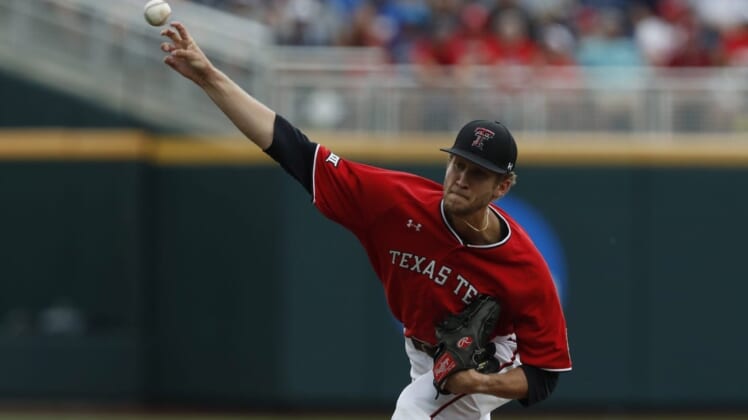 Jun 17, 2019; Omaha, NE, USA; Texas Tech Red Raiders pitcher Caleb Kilian (32) throws in the first inning against the Arkansas Razorbacks in the 2019 College World Series at TD Ameritrade Park . Mandatory Credit: Bruce Thorson-USA TODAY Sports