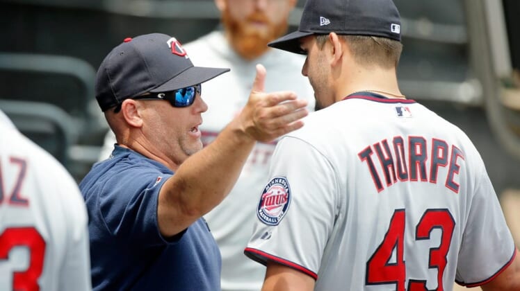 Jun 30, 2019; Chicago, IL, USA; Minnesota Twins starting pitcher Lewis Thorpe (43) talks with pitching coach Wes Johnson (47) in the dugout after pitching against the Chicago White Sox during the first inning in his MLB debut at Guaranteed Rate Field. Mandatory Credit: Jon Durr-USA TODAY Sports