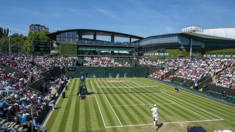 Jul 4, 2019; London, United Kingdom;  General view of Court 3 during the Mikhail Kukushkin (KAZ)  and John Isner (USA) match on day four at the All England Lawn and Croquet Club. Mandatory Credit: Susan Mullane-USA TODAY Sports