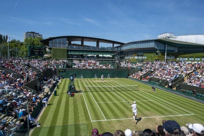 Jul 4, 2019; London, United Kingdom;  General view of Court 3 during the Mikhail Kukushkin (KAZ)  and John Isner (USA) match on day four at the All England Lawn and Croquet Club. Mandatory Credit: Susan Mullane-USA TODAY Sports