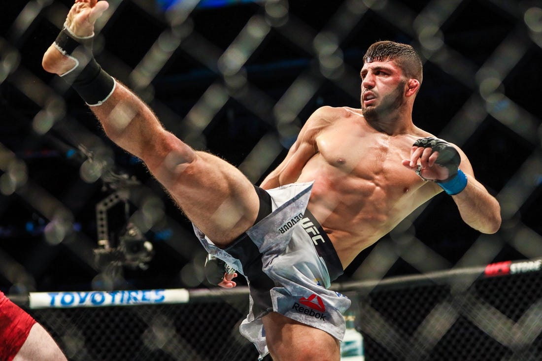 Jul 27, 2019; Edmonton, Alberta, Canada; Arman Tsarukyan (blue gloves) during his fight against Olivier Aubin-Mercier (red gloves) during UFC 240 at Rogers Place. Mandatory Credit: Sergei Belski-USA TODAY Sports