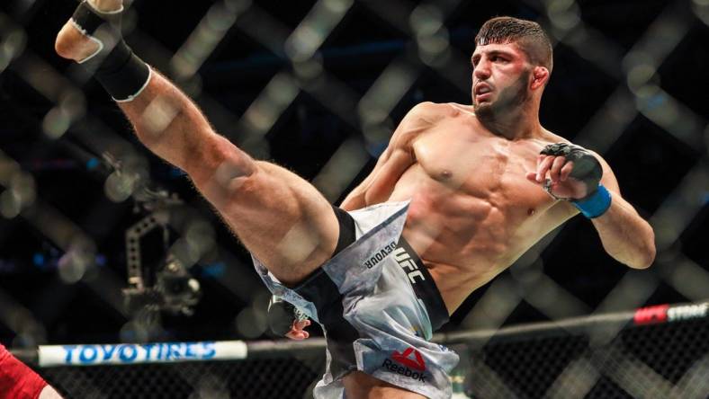 Jul 27, 2019; Edmonton, Alberta, Canada; Arman Tsarukyan (blue gloves) during his fight against Olivier Aubin-Mercier (red gloves) during UFC 240 at Rogers Place. Mandatory Credit: Sergei Belski-USA TODAY Sports