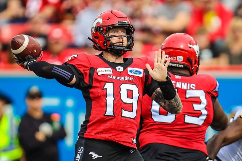Sep 14, 2019; Calgary, Alberta, CAN; Calgary Stampeders quarterback Bo Levi Mitchell (19) throws a pass against the Hamilton Tiger-Cats in the first half during a Canadian Football League game at McMahon Stadium. Mandatory Credit: Sergei Belski-USA TODAY Sports