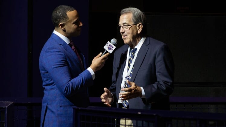 Co-host Josh Landon speaks with former University of Michigan football coach Lloyd Carr during 2019 Michigan Sports Hall of Fame induction ceremony at MotorCity Casino Hotel, Saturday, Oct. 5, 2019.100519 Halloffame Amb 003
