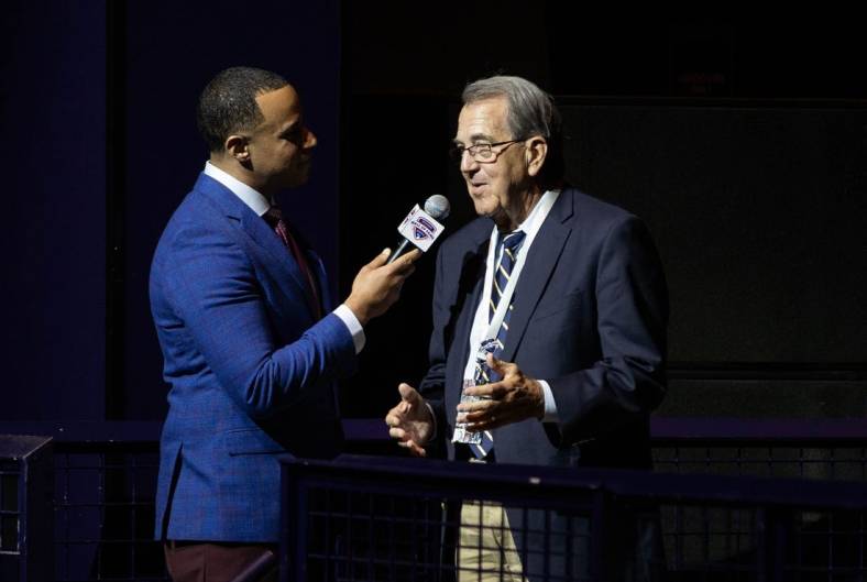 Co-host Josh Landon speaks with former University of Michigan football coach Lloyd Carr during 2019 Michigan Sports Hall of Fame induction ceremony at MotorCity Casino Hotel, Saturday, Oct. 5, 2019.

100519 Halloffame Amb 003