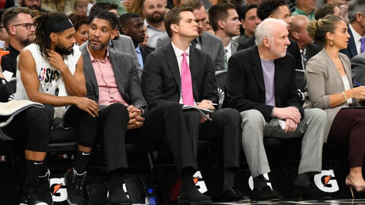 Oct 26, 2019; San Antonio, TX, USA; San Antonio Spurs (from left to right) guard Patty Mills (14), assistant coaches Tim Duncan and Will Hardy, head coach Gregg Popovich and assistant coach Becky Hammon during the third quarter against the Washington Wizards at AT&T Center. Mandatory Credit: Scott Wachter-USA TODAY Sports