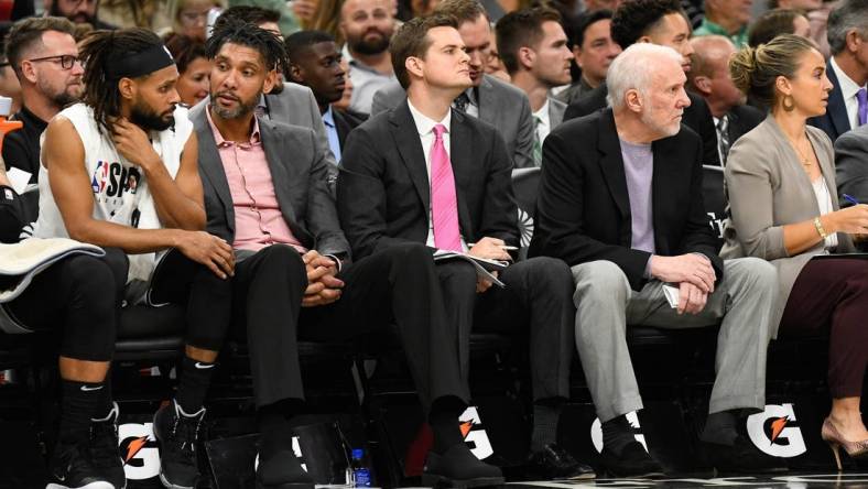 Oct 26, 2019; San Antonio, TX, USA; San Antonio Spurs (from left to right) guard Patty Mills (14), assistant coaches Tim Duncan and Will Hardy, head coach Gregg Popovich and assistant coach Becky Hammon during the third quarter against the Washington Wizards at AT&T Center. Mandatory Credit: Scott Wachter-USA TODAY Sports