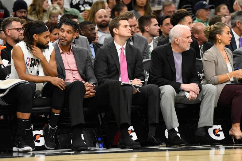 Oct 26, 2019; San Antonio, TX, USA; San Antonio Spurs (from left to right) guard Patty Mills (14), assistant coaches Tim Duncan and Will Hardy, head coach Gregg Popovich and assistant coach Becky Hammon during the third quarter against the Washington Wizards at AT&T Center. Mandatory Credit: Scott Wachter-USA TODAY Sports