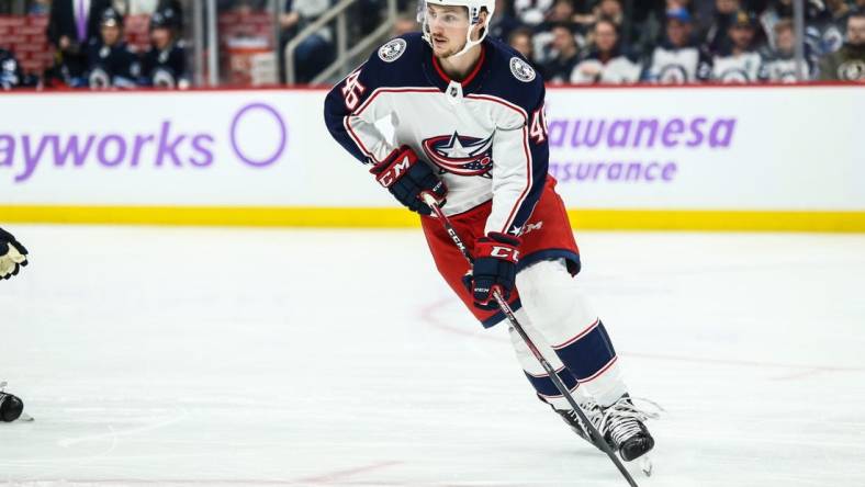 Nov 23, 2019; Winnipeg, Manitoba, CAN; Columbus Blue Jackets forward Lukas Sedlak (45) looks to make a pass against the Winnipeg Jets during the second period at Bell MTS Place. Mandatory Credit: Terrence Lee-USA TODAY Sports