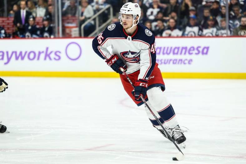 Nov 23, 2019; Winnipeg, Manitoba, CAN; Columbus Blue Jackets forward Lukas Sedlak (45) looks to make a pass against the Winnipeg Jets during the second period at Bell MTS Place. Mandatory Credit: Terrence Lee-USA TODAY Sports