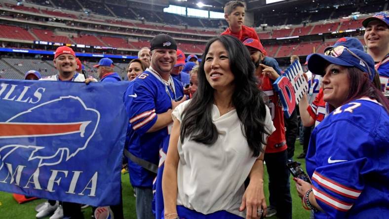 Jan 4, 2020; Houston, Texas, USA; Buffalo Bills owner Kim Pegula poses for pictured with fan before the AFC Wild Card NFL Playoff game against the Houston Texans at NRG Stadium. Mandatory Credit: Kirby Lee-USA TODAY Sports